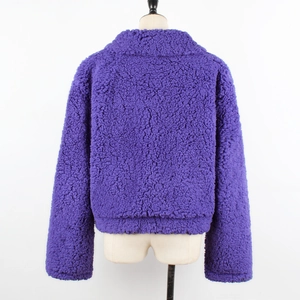 Detail view of the plush purple faux shearling texture and large lapel collar on the coat