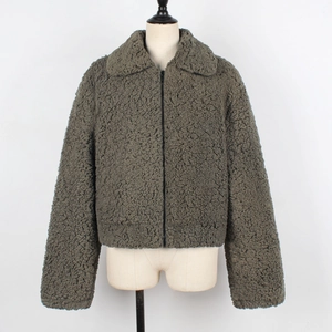 Detailed macro texture of thick faux sheepskin fleece on winter jacket with lapels