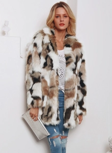 Detail of color-block faux fur coat with geometric pattern and rich textured faux fur