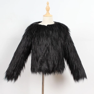 Detail of black faux fur kid jacket on wooden mannequin featuring long plush texture