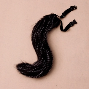 Macro view of adjustable faux fur fox tail with black and white stripes for cosplay