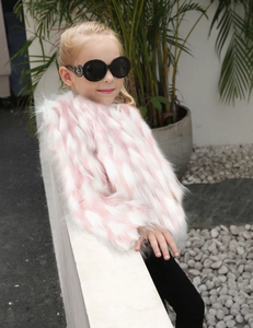 Detailed view of pink and white striped faux fur coat with decorative sunglasses