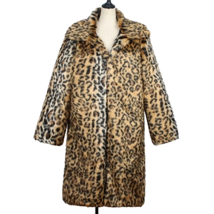 Close-up detail of leopard print faux fur coat featuring wide lapels and thick texture
