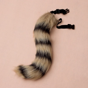 Macro detail of adjustable faux fur fox tail accessory with buckle for cosplay costumes