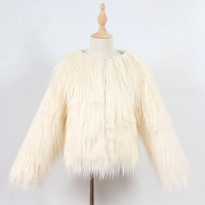 Detail of soft cream faux fur texture on elegant round neck children coat