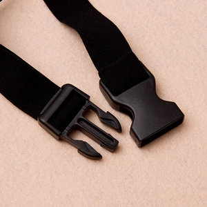Detail of adjustable black elastic strap with plastic buckle for feline costume tail