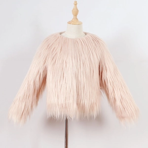 Detailed macro view of the fluffy light pink faux fur texture and long pile material