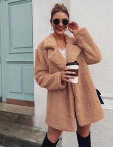 Outdoor street style view of a brown teddy coat for women with classic lapel design