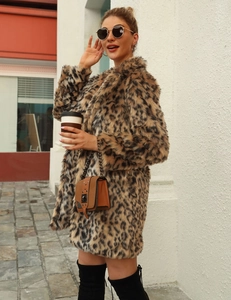Outdoor street style shot of long faux fur leopard print coat with a notched lapel design