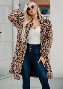 Detailed texture of leopard print faux fur coat with metal button high waist jeans