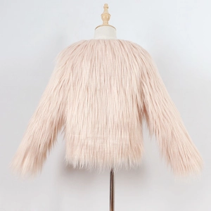 Detail view of pink faux fur kid's jacket featuring plush texture and soft long pile material