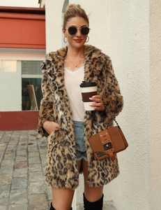 Detailed view of leopard print faux fur coat texture and stylish leather crossbody bag