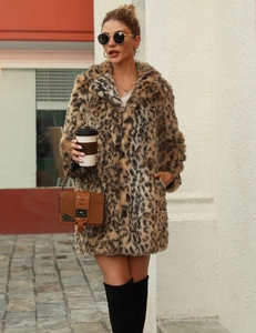 Outdoor street shot of a woman in a leopard faux fur coat with a wide lapel collar