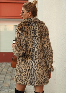 Detailed back view of a plush leopard print faux fur coat for women in outdoor street style