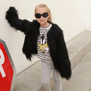 Chic black faux fur coat for kids with fluffy texture and stylish streetwear aesthetic