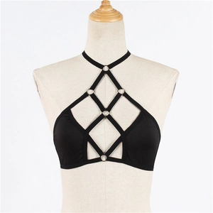 Fashionable black elastic harness bra top with silver metal rings on a beige mannequin