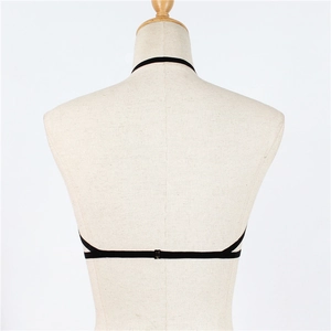 Detail of the back view showing black elastic body harness with metal buckle on a mannequin