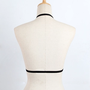 Minimalist black elastic strap harness lingerie accessory with neck and back wrap detail