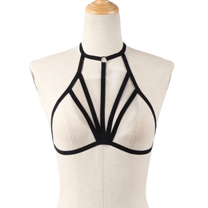 Sexy black elastic cage bra harness with silver metal ring on female mannequin torso