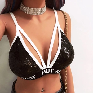 Detail of black sequined bralette with white hot letter elastic band and thin straps