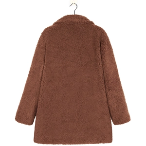 Detail view showing the plush faux fur texture of a dark brown teddy coat's back