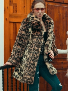 Detailed view of the thick faux fur texture and leopard pattern on the lapel coat