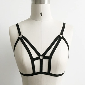 Detail of black cage bra showing elastic straps and silver metal ring connectors