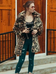 Chic leopard print faux fur coat detail with wide collar and plush texture on model
