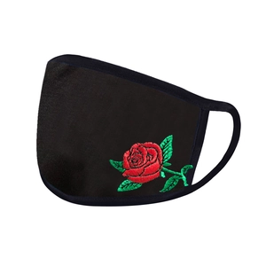Detail of black cotton face mask with premium red rose embroidery and elastic ear loops