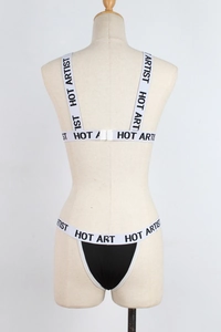 Detail of sport lingerie set with HOT ARTIST elastic band and black fabric on mannequin