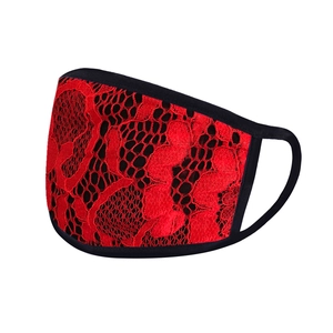 Close-up of red lace sun protection mask with black fabric trim and ear loops