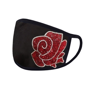 Detail of red rhinestone rose pattern on breathable black fabric face mask