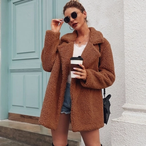 Fashionable long caramel teddy coat with wide lapels and cozy textured sherpa fabric