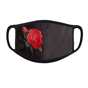 Close-up of elegant red rose embroidery on breathable black fabric protective face mask