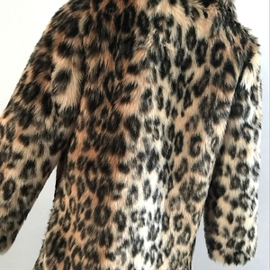 Close-up of the thick faux fur texture and leopard print pattern on this winter coat