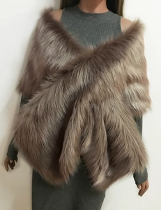 Close-up of fluffy brownish grey faux fox fur bridal shawl styled on a mannequin