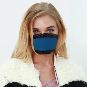 Detail of breathable blue lace face mask with black floral lace trim for sun protection