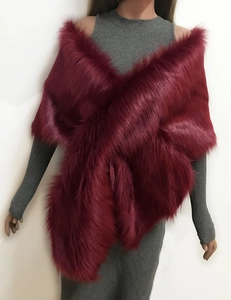 Detail of burgundy faux fur shawl showing dense plush texture and cross-wrap design