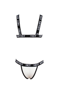 Detail of white lingerie set with black elastic bands featuring HOT ARTIST text