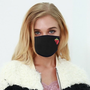 Detail of washable black fabric face mask with strawberry embroidery on earloop mask