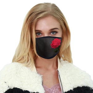 Washable black fabric mask with red rose embroidery worn by a model in spring summer