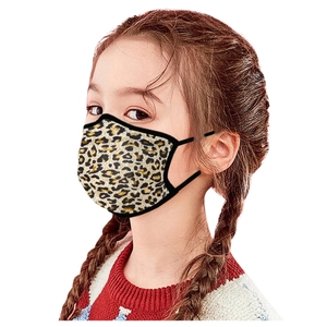 Washable leopard print fabric face mask for children with elastic ear loops shown on a girl