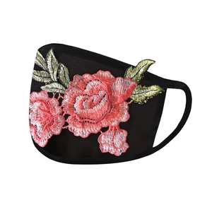 Detail of premium red rose embroidery on breathable black washable sun protection face mask
