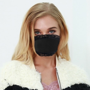 Detail of elegant black lace trimming on breathable face mask for sun protection