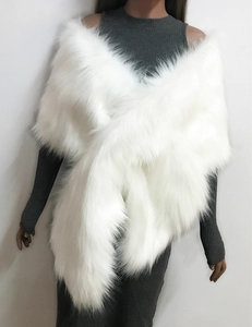 Detail of plush white faux fox fur wrap showing thick texture for bridal gowns