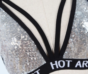 Detail of silver sequined cropped top with HOT AR lettered elastic band
