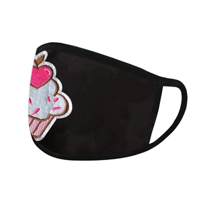 Close-up of washable black fabric face mask featuring a cute cupcake embroidery detail