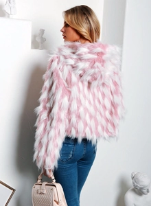 Detail view of pink and white faux fur hooded jacket with soft plush diamond texture