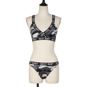 Close-up of camo lingerie set with sexy baby lettering on the elastic band