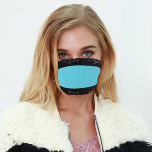 Detail view of sky blue lace face mask with black floral trim for sun protection